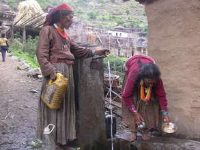Women using DWS to collect water