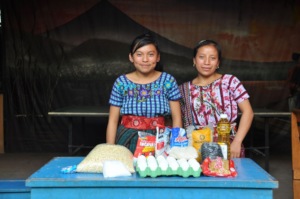 Concepcion and her mother receive a food basket