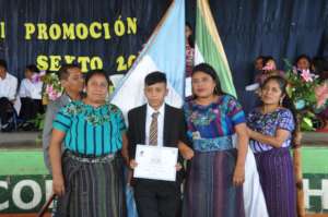 Sponsored student Diego with his mother and sister