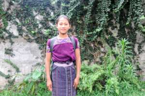 Fourth-grader Dorcas with her school backpack