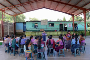 Women gathered for the "charla"