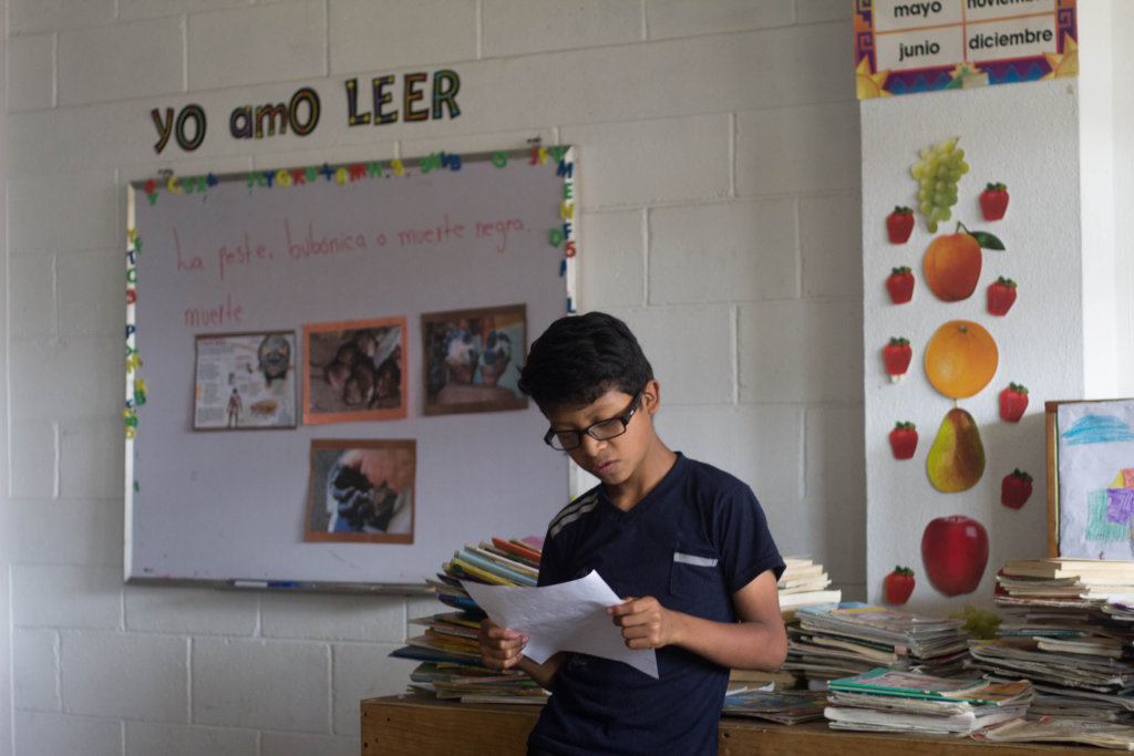 Franco, a 4th grade student, reading a story
