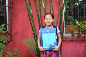 Sponsored student Juana receives her new backpack