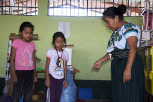 Concepcion helps students find their uniforms