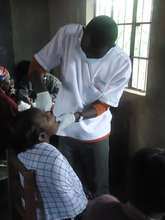 David giving exam to patient