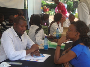 Dental volunteers consulting with patients