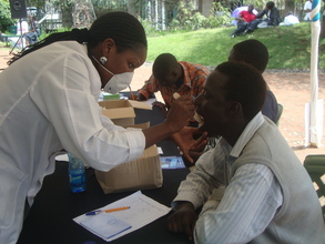 Dental care volunteers examining patients