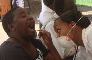Dentist examining patient