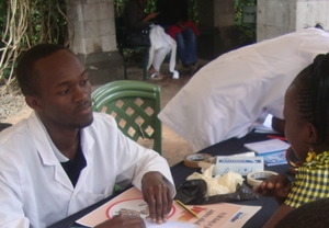 David Mundia taking a history of patient