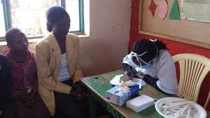 Patients registering at David's clinic