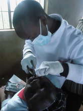Dr. Mundia examining patient