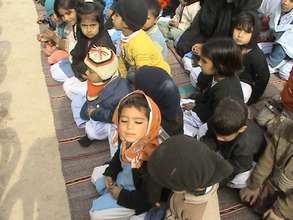 Students say a prayer at ground-breaking ceremony
