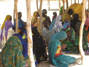 Women waiting at an outreach health post.