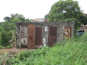 Outside of crumbling latrines at clinic site
