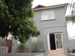 The building - we like the Mango Tree in front