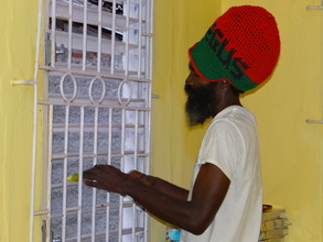 Reggae Singer, I Righteous helps to clean window