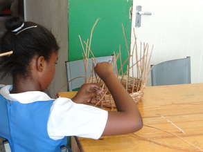 Student Making a Basket in Arts and Crafts Section